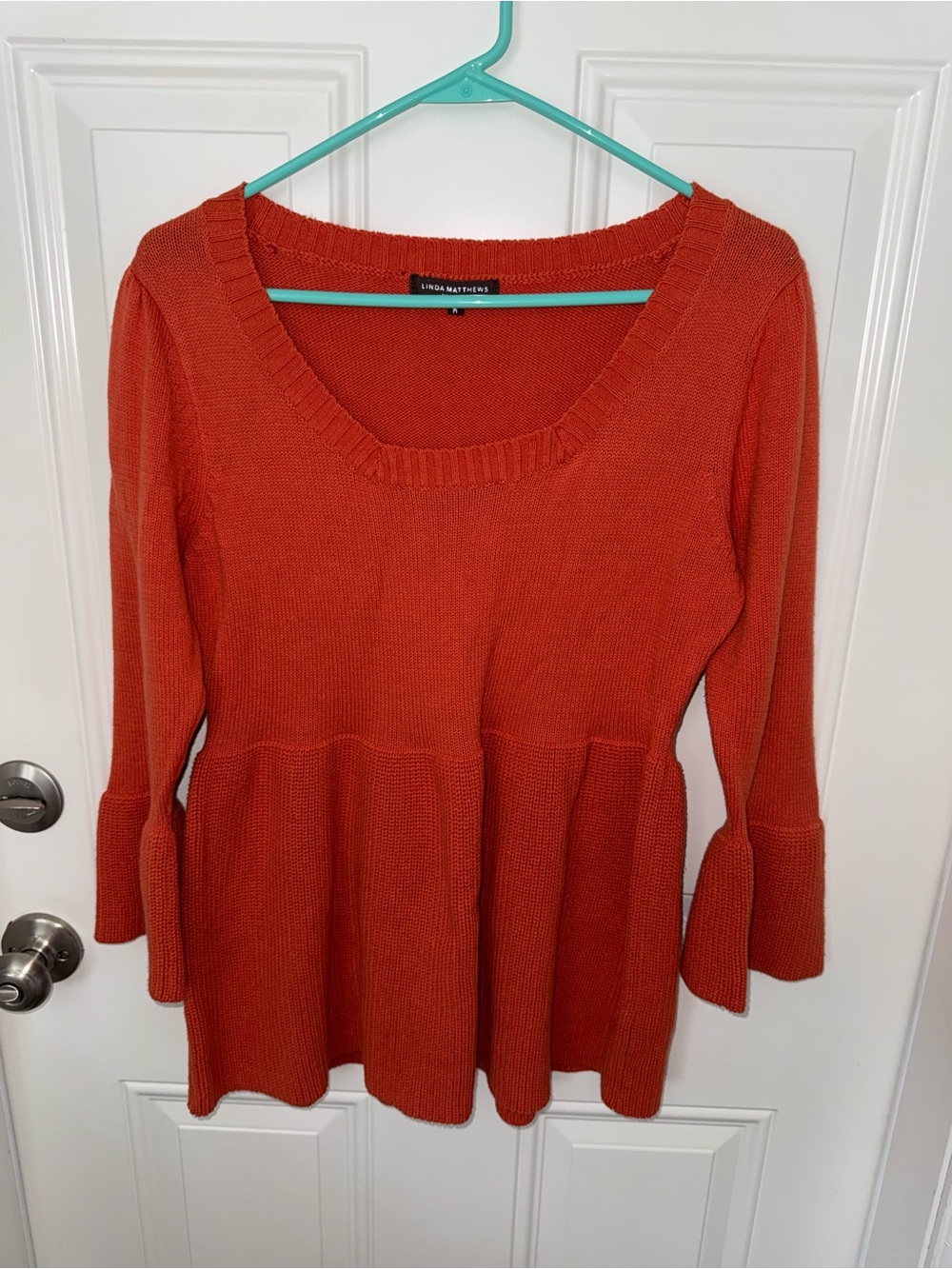 Knit & Thread Scoop Neck Peplum Sweater in burnt Orange